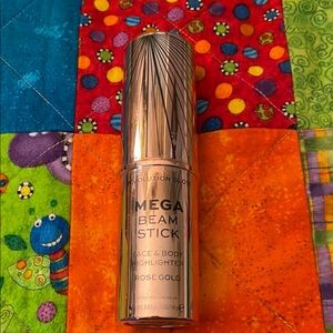 NWT MEGA BEAM STICK BY Revolution.  Face & body highlighter.  Rose gold.